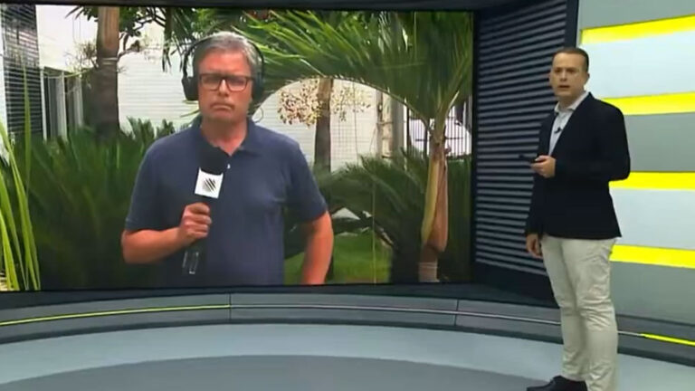 Apresentador Ricardo Ishmael no estúdio e repórter Carlos Augusto em link ao vivo no telão do Jornal da Manhã, da TV Bahia