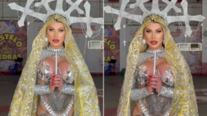 Andressa Urach com fantasia prateada e dourada de temática religiosa segura um cajado em ensaio fotográfico para o Carnaval 2026