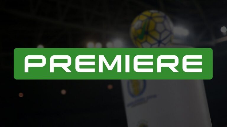 Logotipo do canal Premiere em fundo de estádio de futebol desfocado com refletores acesos