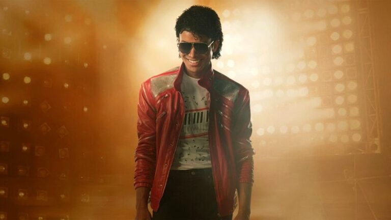 Homem com jaqueta vermelha e óculos escuros em palco iluminado inspirado em Michael Jackson