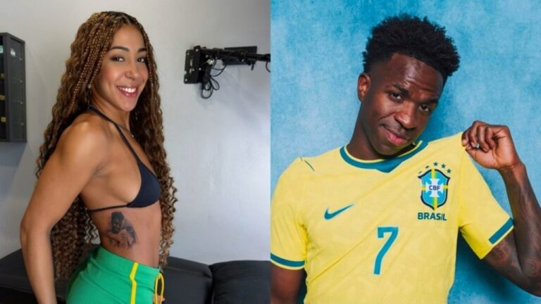 Emelly Souza de biquíni preto sorri em ambiente interno ao lado de Vini Jr com camisa da seleção brasileira segurando o escudo