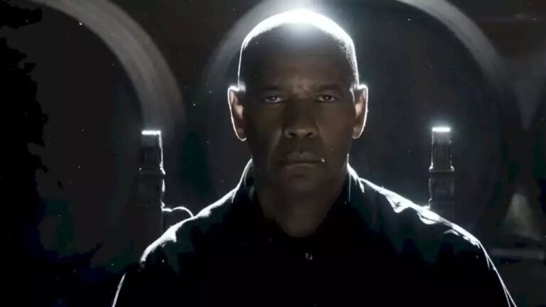 Denzel Washington encara adversários em ambiente escuro em cena do filme O Protetor