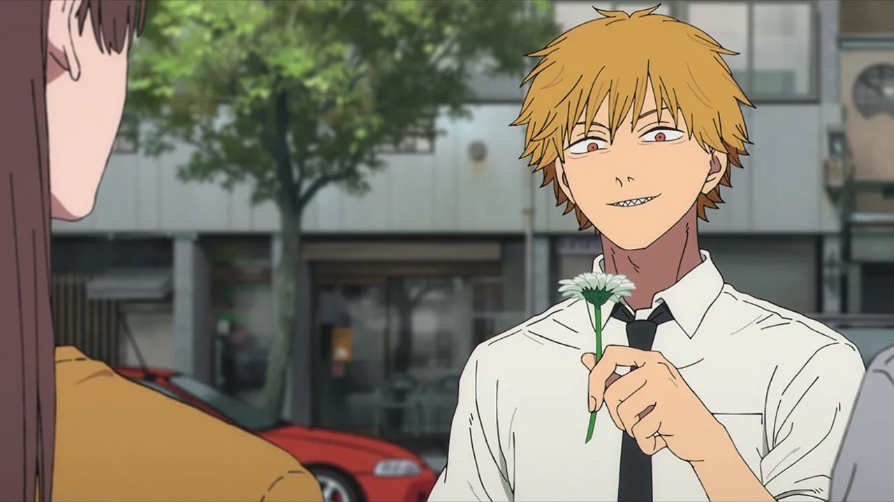 Denji segura uma flor e sorri para Makima em cena do anime Chainsaw Man disponível no Crunchyroll