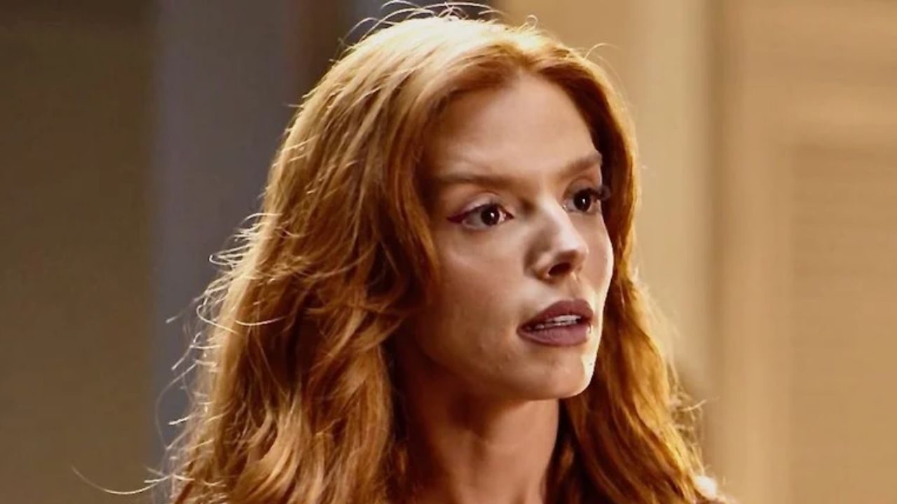 Giovanna Lancellotti com expressão apreensiva em cena de novela durante conversa decisiva sobre conflito familiar ou amoroso