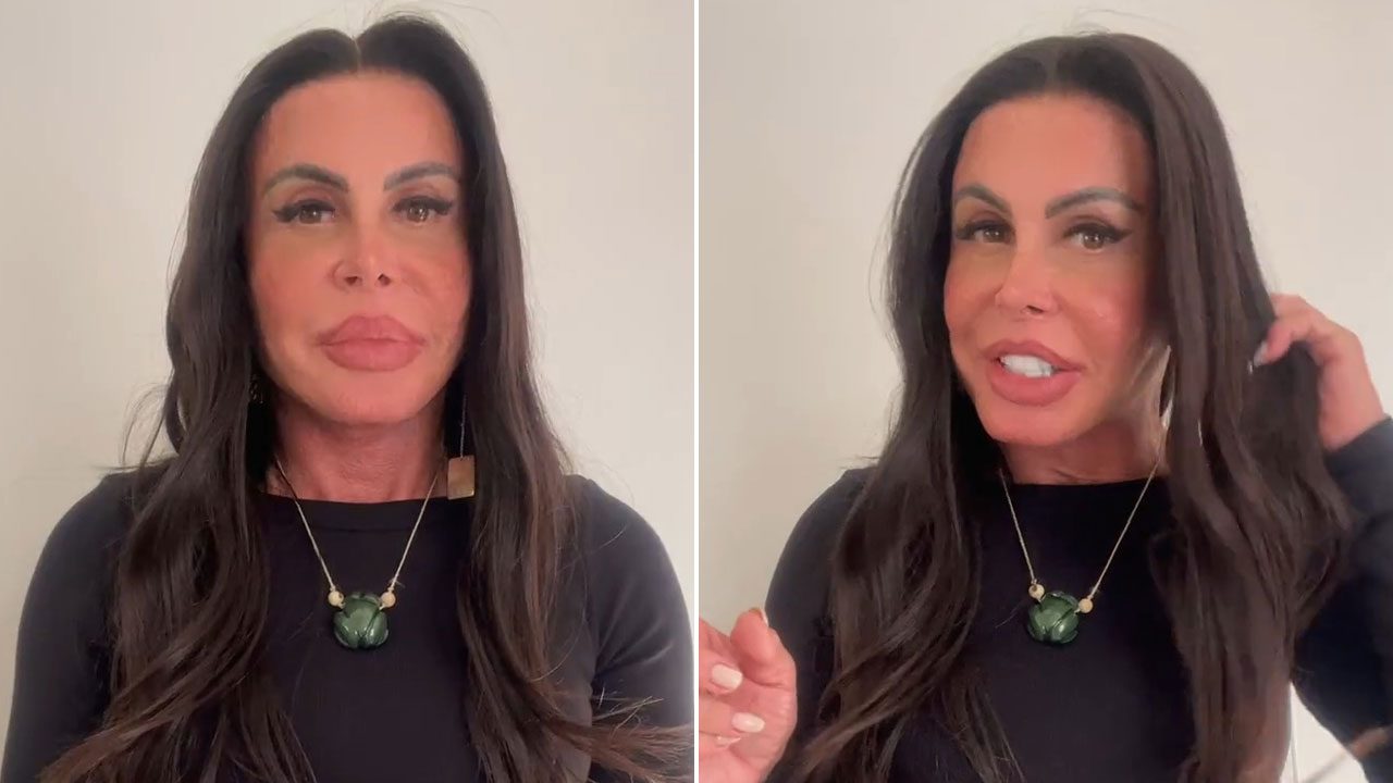 Gretchen fala diretamente para a câmera em vídeo publicado nas redes sociais usando blusa preta e colar verde