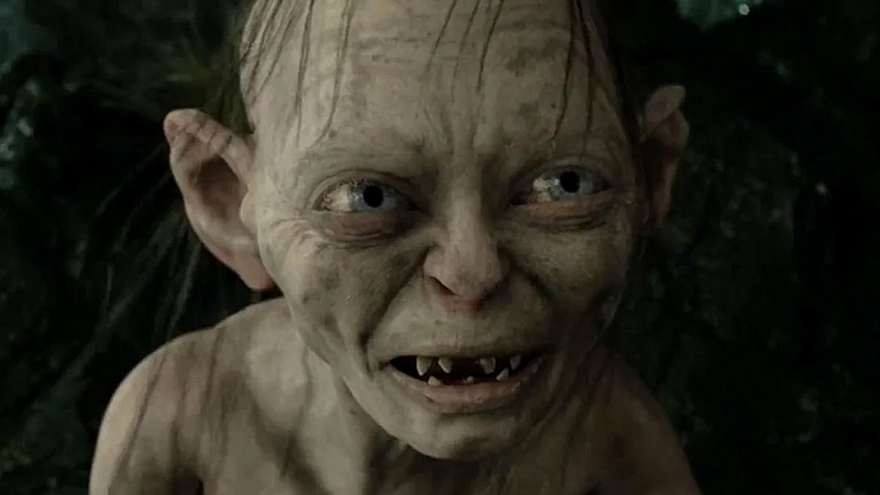 Criatura Gollum com expressão intensa em cena do filme O Senhor dos Anéis