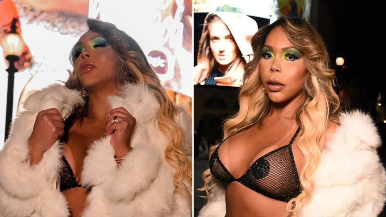 Suellen Carey caracterizada como Mariah Carey com casaco branco e lingerie preta em ensaio noturno na rua